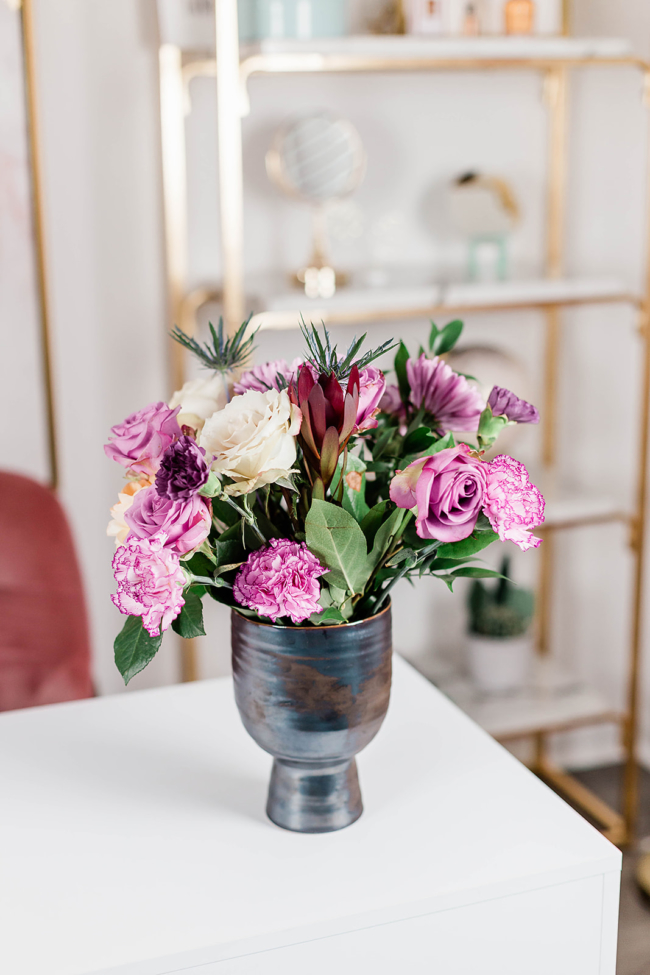 woman working from home at desk, UrbanStems, Flower Delivery, Fresh Florals, Black Girl Arranging Flowers, Black woman decorating in her home, Flower arranging