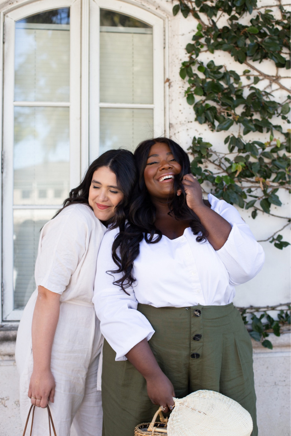 Friends hugging, Black girl smiling